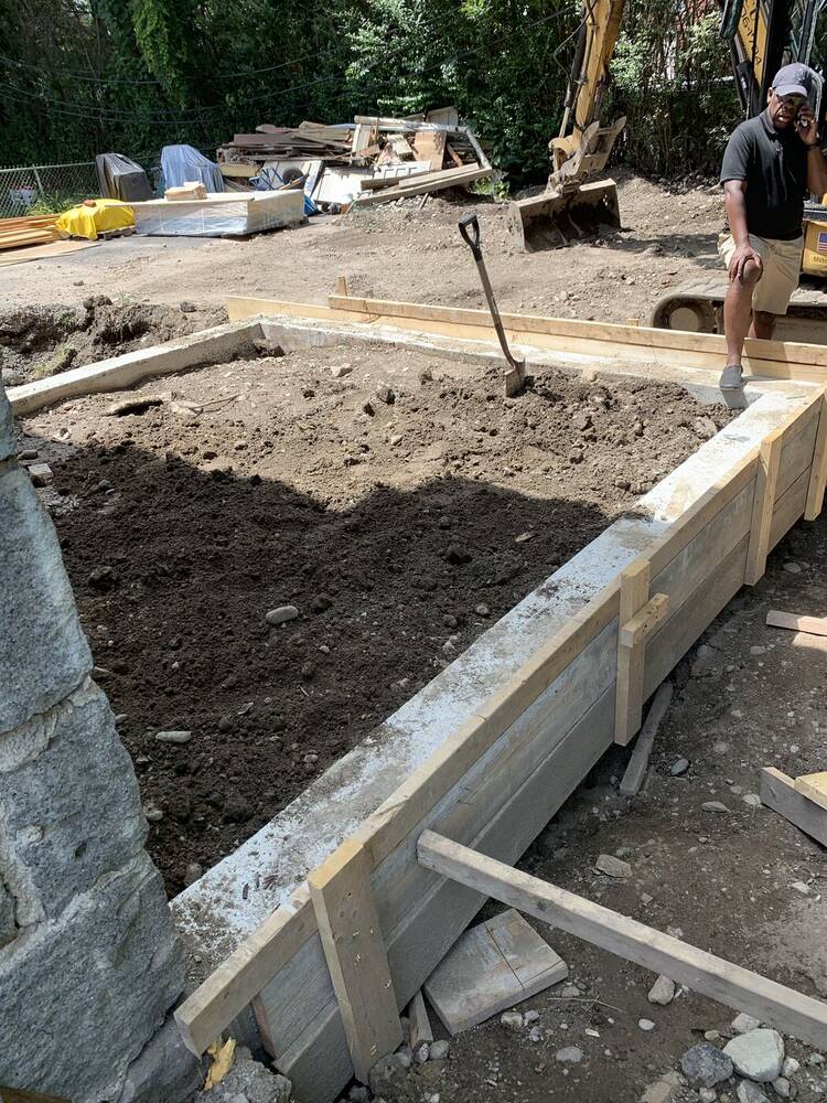 Concrete foundation forms set for the new rear addition