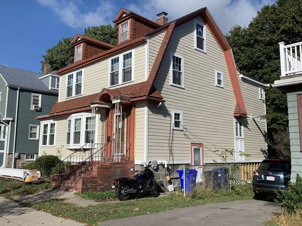 Side view of the finished Dutch colonial and rear addition