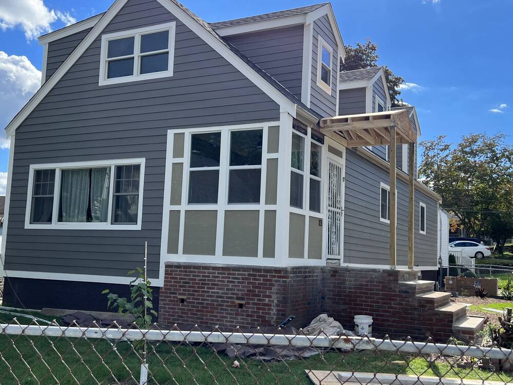 Sunroom windows and side entry with new siding