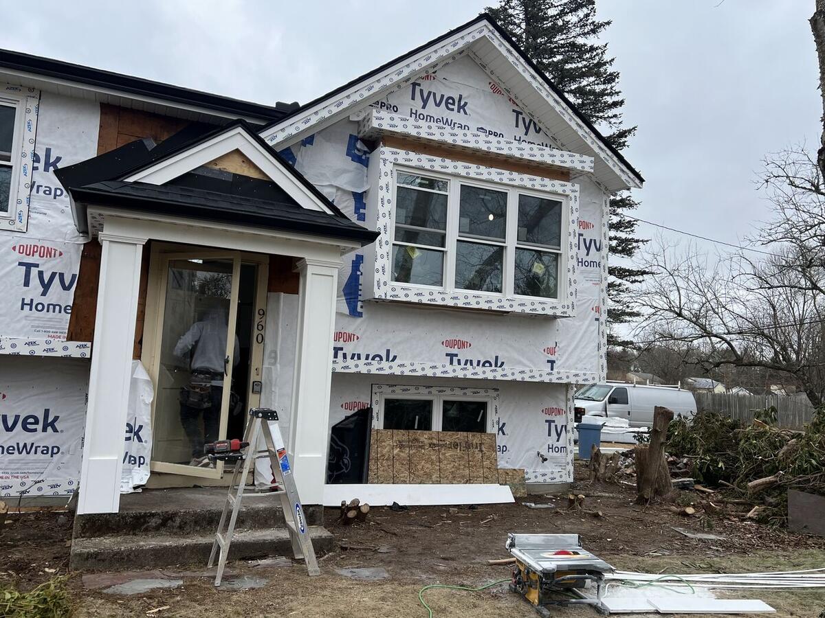 Front entry portico and gable bump-out nearly framed out