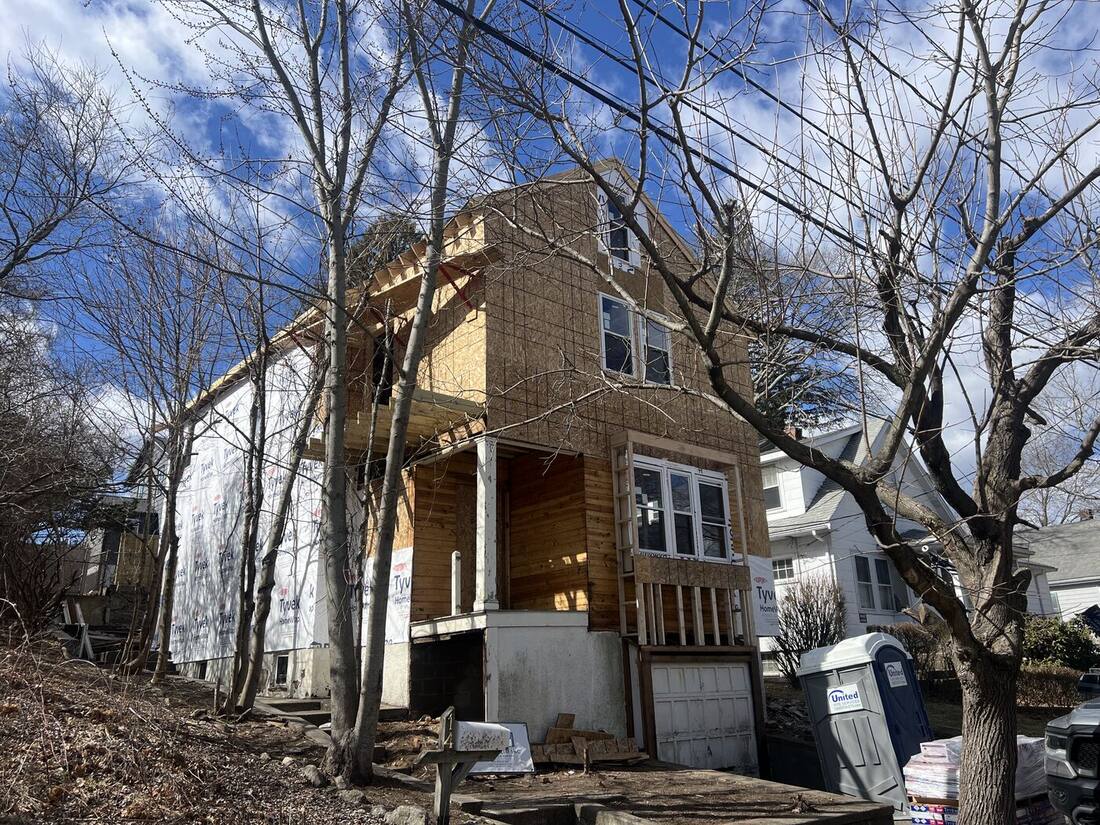 Front porch and balcony framing on the new two-story house