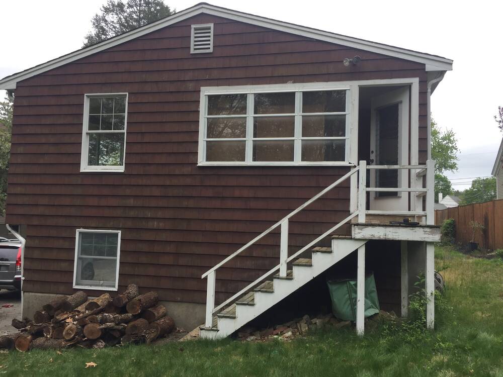 Back of the house before, with the old narrow wooden stairs and landing