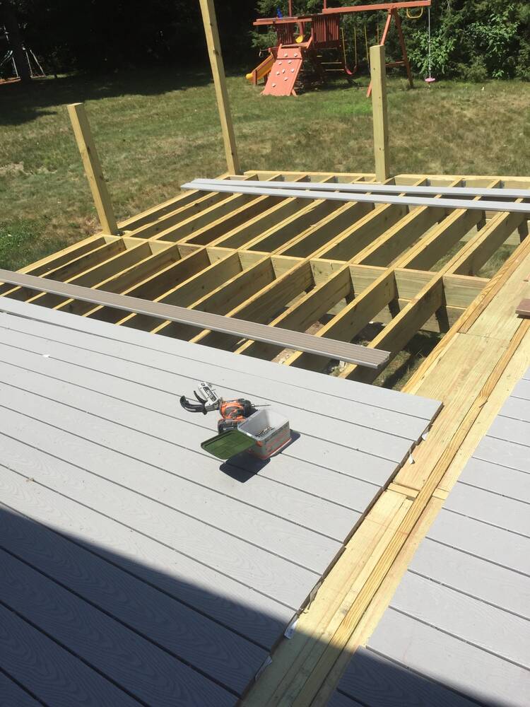 Deck joists framed and composite decking going down