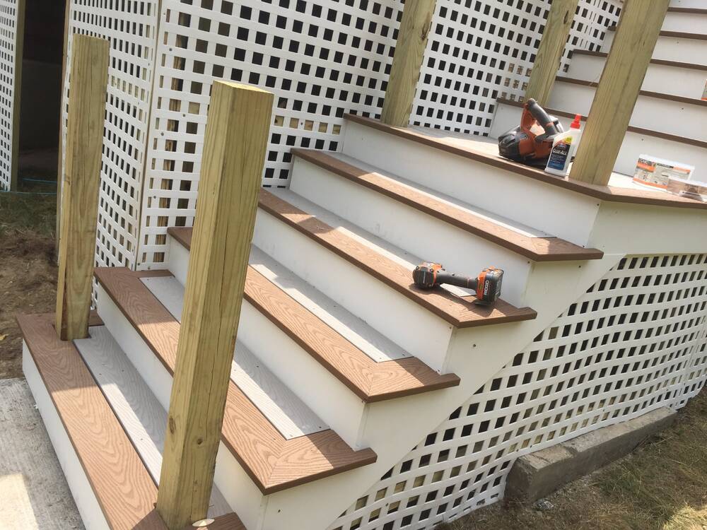Close-up of two-tone composite stair treads with picture-frame borders