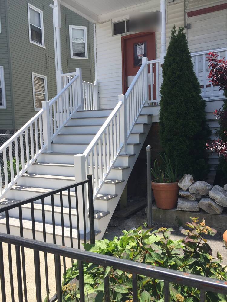 Finished front stairs seen from the sidewalk