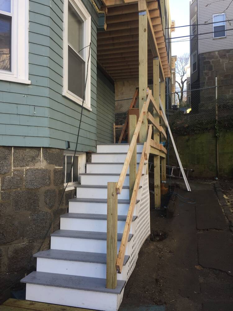 New composite treads and white risers, with temporary handrails