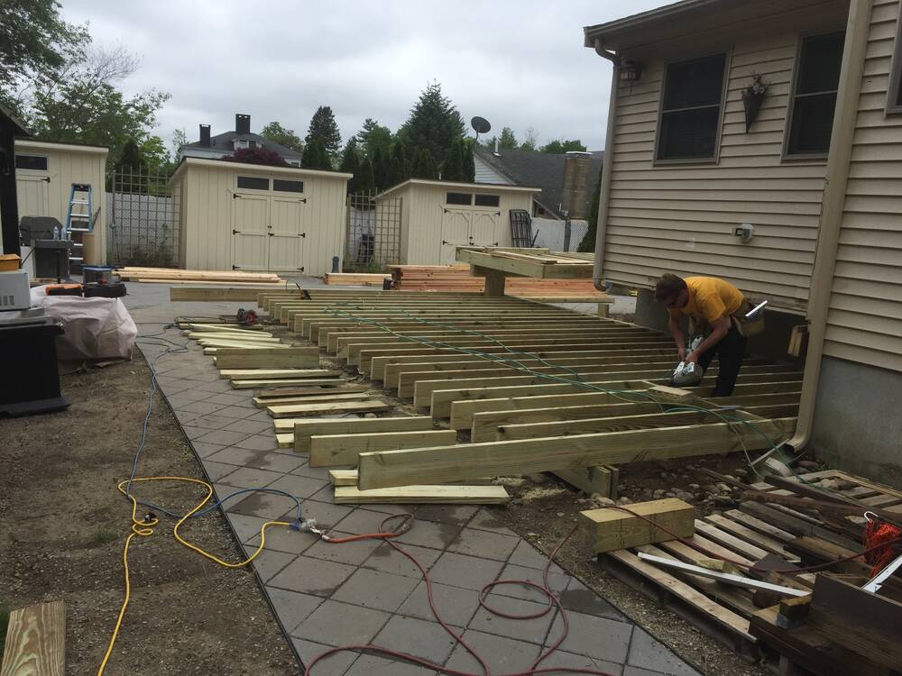 Pressure-treated joists for the new deck going in beside the house