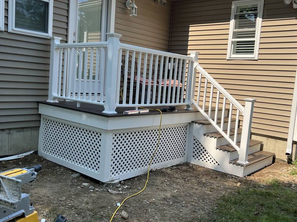 Finished rear landing with stairs, railings and lattice skirting
