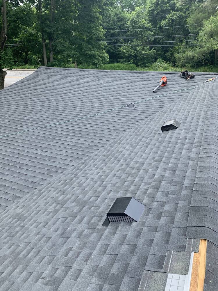 Finished shingle roof with vents and clean edges