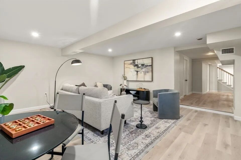 Open basement with dining nook, opening to the stair hall